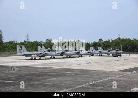 A group of F-15C Eagles sit in a row at Muniz Air National Guard Base in Carolina, Puerto Rico in support of North American Aerospace Defense Command’s (NORAD) Operation Noble Defender (OND), 27 June, 2022. As a part of OND, which is a recurring operation, the Continental U.S. NORAD Region (CONR) coordinated and conducted joint operations with the U.S. Navy while concurrently launching jets from different locations across the United States' gulf coast and Puerto Rico. OND, is an integrated air and missile defense operation designed to ensure the defense and security of the northern and souther Stock Photo