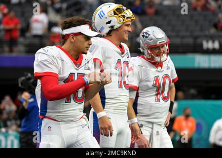 AFC quarterback's Mac Jones of the New England Patriots (10), left, Justin  Herbert of the Los Angeles Chargers (10), and Patrick Mahomes of the Kansas  City Chiefs (15) during the first half