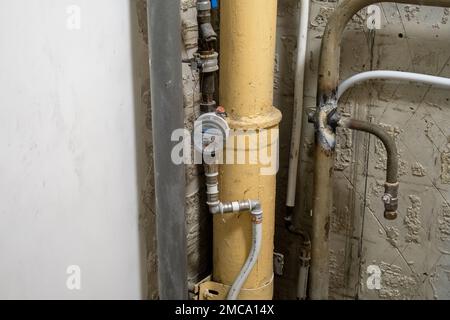 Plumbing system in old premises. Water drainage circuit, Plumbing problems, Works related to leaking faucet, Dark tone, Selective focus. Stock Photo
