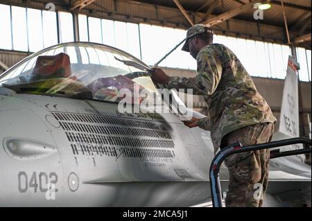 Col. Thomas Graham, 52nd Operations Group commander, renders the first ...