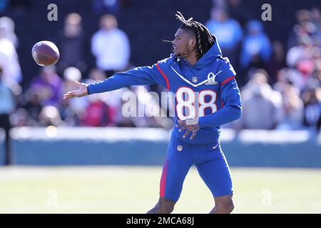 NFC wide receiver CeeDee Lamb of the Dallas Cowboys tosses a ball to a  teammate during Pro Bowl NFL football practice, Friday, February 4, 2022,  in Las Vegas. (Gregory Payan/AP Images for