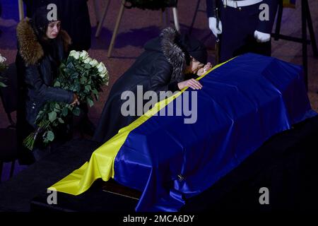 Kyiv, Ukraine. 21st Jan, 2023. Family members break down and weep at the caskets of government officials killed in a helicopter crash during the funeral at the Ukrainian House National Center, January 21, 2023 in Kiev, Ukraine. Internal Affairs Minister Denys Monastyrskyi, and 17 died in the incident on January 18th. Credit: Ukraine Presidency/Ukrainian Presidential Press Office/Alamy Live News Stock Photo