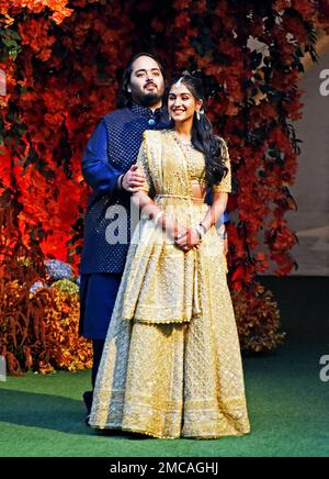 Anant Ambani, son of Mukesh Ambani, the Chairman of Reliance Industries, and Radhika Merchant, daughter of Encore Healthcare CEO Viren Merchant, pose during a photo opportunity at the Red Carpet ceremony to celebrate their engagement at Ambani's Antilia residence in Mumbai, India, 19 January, 2023. (Photo by Indranil Aditya/NurPhoto)0 Credit: NurPhoto SRL/Alamy Live News Stock Photo
