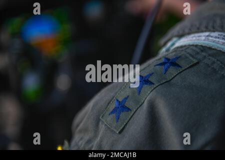 Three stars representing a lieutenant general sit on 5th Air Force commander, Lt. Gen. Ricky Rupp’s shoulder while prepping to fly a C-130J Super Hercules assigned to the 36th Airlift Squadron at Yokota Air Base, Japan, June 28, 2022. Maintaining flight currency reinforces Yokota’s multi-capable presence in the Indo-Pacific region. Stock Photo