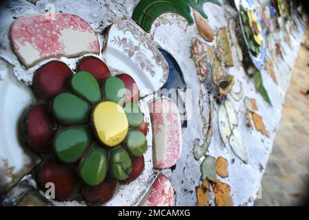 Various ceramic patterns and designs made of broken pottery pieces - decorative motives of architectural details. Colourful destroyed porcelain pieces Stock Photo
