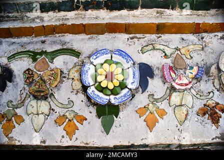Various ceramic patterns and designs made of broken pottery pieces - decorative motives of architectural details. Colourful destroyed porcelain pieces Stock Photo