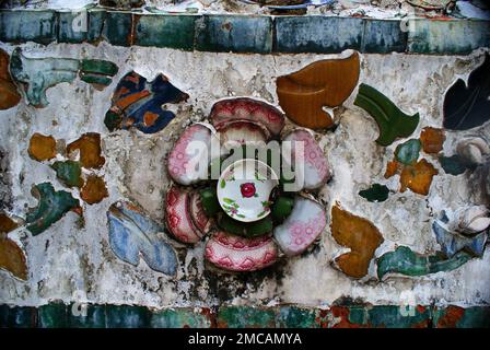 Various ceramic patterns and designs made of broken pottery pieces - decorative motives of architectural details. Colourful destroyed porcelain pieces Stock Photo