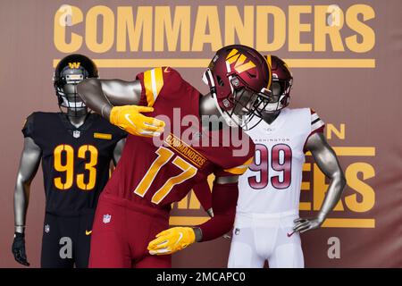 A Washington Commanders jersey is displayed at an event to unveil the NFL  football team's new identity, Wednesday, Feb. 2, 2022, in Landover, Md. The  new name comes 18 months after the