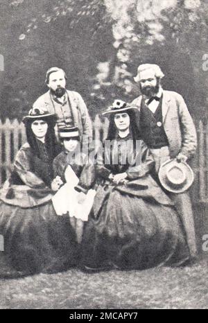 Karl Marx, Friedrich Engels and Karl Marx's daughters Eleanor and Laura. Photo from 1864. Stock Photo