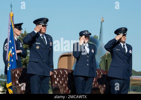 U.S. Air Force Chief Master Sgt. Lee Mills, left, Lt. Gen. David Krumm, Col. Kirsten Aguilar, and Col. David Wilson salute the American flag during the 673d Air Base Wing and Joint Base Elmendorf-Richardson, Alaska, change of command ceremony at Heritage Park on JBER, June 28, 2022. U.S. Air Force Col. Kirsten G. Aguilar turned over command to Col. David J. Wilson as Lt. Gen. David A. Krumm, commander Alaskan North American Aerospace Defense Region, Alaskan Command, and 11th Air Force, officiated before gathered family members, distinguished guests and military personnel. Stock Photo