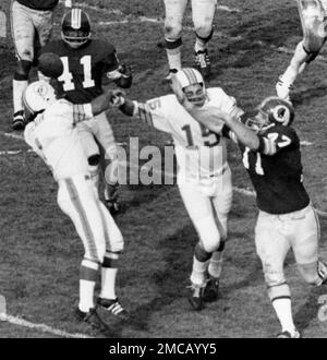 FILE - Washington Redskins' Mike Bass (41) gets the ball which deflected  out of Miami Dolphins kicker Garo Yepremian's (1) hands during NFL  football's Super Bowl VII in Los Angeles, Jan. 14, 1973. Yepremian's  aborted field goal attempt turned into