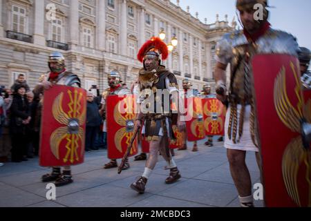 Madrid, Spain. 21st Jan, 2023. Roman legionnaires walk in front of the Royal Palace of Madrid during the Arde Lucus parade Within the framework of FITUR 2023, the Roman representation Arde Lucus toured the streets of Madrid to promote and publicize this festivity. Originally from Lugo, Galicia, this initiative has been commemorating the founding of the city since 2002 through the recreation of its Roman past. Credit: SOPA Images Limited/Alamy Live News Stock Photo