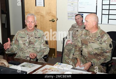 Army National Guard Director Lt. Gen. Jon Jensen (left) met with members of the 28th Infantry Division senior trainer team, including Command Sgt. Maj. Keith Kempinski (center) and Brig. Gen. Michael Wegscheider on June 28, 2022 at Fort Irwin, Calif. Jensen, senior trainer Wegscheider (28 ID’s division deputy commanding general – maneuver), and other team members discussed the STT’s role in supporting the division’s 56th Stryker Brigade Combat Team during its National Training Center Rotation. Stock Photo