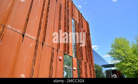 Modern facade covered in unique Corten steel and glass materials. Stock Photo
