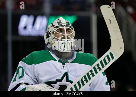 Dallas Stars goaltender Braden Holtby looks up at the video