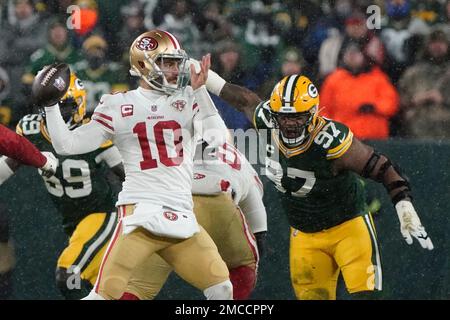 Green Bay, Wisconsin, USA. 22nd Jan, 2022. San Francisco 49ers quarterback  Jimmy Garoppolo (10) getting sacked by Green Bay Packers nose tackle Kenny  Clark (97) during the NFL divisional playoff football game