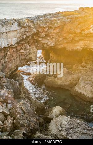 Natural landmark Boca do Inferno or Hell's mouth in Cascais city at sunset, Portugal Stock Photo