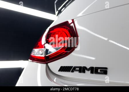 The Gloss Black AMG Badge On The Boot lid Of A White 2016 Mercedes C63s AMG Edition 1 With Carbon Fibre Rear Spoiler Stock Photo