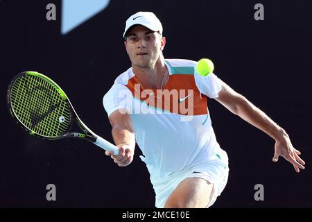 Miomir Kecmanovic of Serbia plays a forehand return to Salvatore