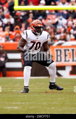 Cincinnati Bengals guard Jackson Carman (79) and offensive tackle D'Ante  Smith (70) walk off the field after an NFL football game against the  Baltimore Ravens, Sunday, Dec. 26, 2021, in Cincinnati. (AP