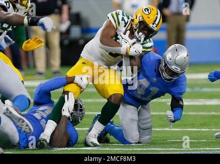 Green Bay Packers running back Patrick Taylor is tackled by