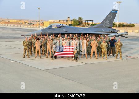 Members of the 179th Expeditionary Fighter Squadron watch as an ...