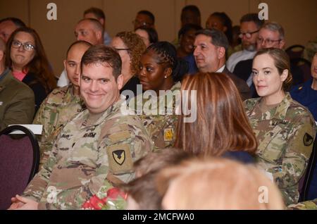 FORT MEADE, Md - Lt. Col. Stephen P. Ward, the outgoing commander of the Headquarters Command Battalion, United States Army Garrison Meade, smiles at his family during a formal change of command ceremony here, June 30. Fellow Soldiers, friends and family gathered to honor the leadership that Ward demonstrated during his command at HCB. Stock Photo