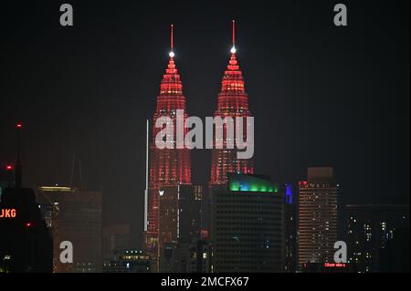 Kuala Lumpur, Malaysia. 21st Jan, 2023. The Petronas Twin Towers are illuminated in red in celebration of the Chinese New Year in Kuala Lumpur, Malaysia, Jan. 21, 2023. Credit: Chong Voon Chung/Xinhua/Alamy Live News Stock Photo