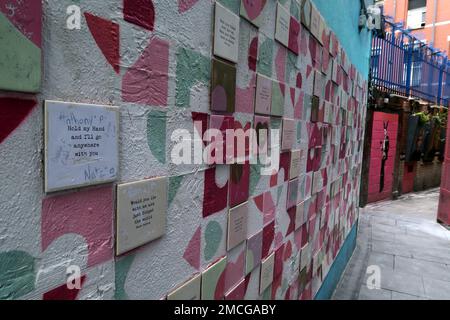 Art in a Love Lane backstreet of The Temple Bar, tiles and text / poems - Love from Dublin, hold my hand and I will go anywhere with you Stock Photo