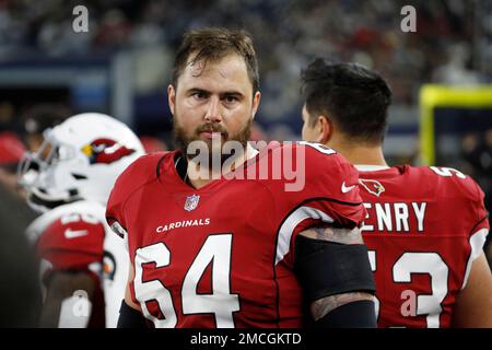 Arizona Cardinals center Sean Harlow runs onto the field at the News  Photo - Getty Images