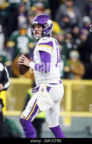 Green Bay, Wisconsin, USA. 02nd Jan, 2022. Minnesota Vikings quarterback  Sean Mannion #14 throws a pass during NFL football game between the  Minnesota Vikings and the Green Bay Packers at Lambeau Field