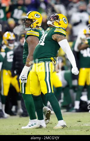 Green Bay, United States. 22nd Jan, 2022. Green Bay Packers Rashan Gary  (52) celebrates his sack on San Francisco 49ers quarterback Jimmy Garoppolo  (10) with Preston Smith (91) in the first quarter