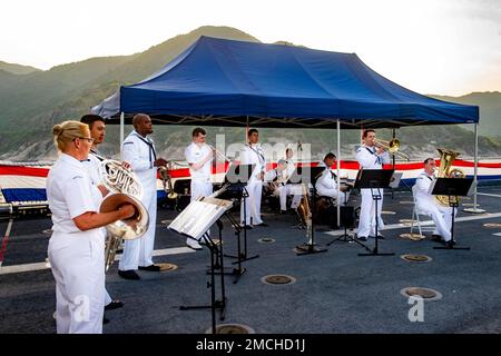 VUNG RO BAY, Vietnam (July 3, 2022) - The U.S. Pacific Fleet Band, including musicians from the Royal Australian Navy, performs during the Pacific Partnership 2022 (PP22) Vietnam closing ceremony held aboard Military Sealift Command hospital ship USNS Mercy (T-AH 19). Now in its 17th year, Pacific Partnership is the largest annual multinational humanitarian assistance and disaster relief preparedness mission conducted in the Indo-Pacific. Stock Photo