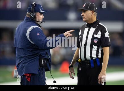 Dallas Cowboys head coach Mike McCarthy talks with line judge Mark