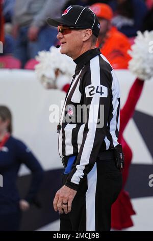 Down judge David Oliver (24) watches a replay on the video board