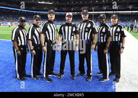 Game officials pose on the field before an NFL football game between the Minnesota  Vikings and the Chicago Bears, Sunday, Dec. 30, 2018, in Minneapolis. Shown  are replay assistant Willie Vizoso, from