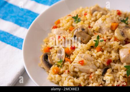 Original spanish paella recipe with chicken and vegetables. Stock Photo