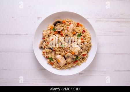 Original spanish paella recipe with chicken and vegetables. Stock Photo