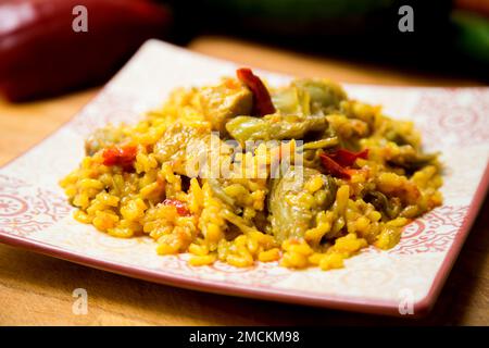 Original spanish paella recipe with chicken and vegetables. Stock Photo