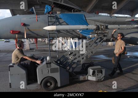 44th Aircraft Maintenance Unit weapons load crew lifts an AIM-9 ...