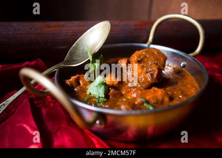 Korma, also qorma Kavurma or kurma, is a mild-flavored curry originating in India and Turkey, often made with yogurt sauce, heavy cream, or nuts. Stock Photo