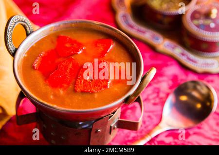 Korma, also qorma Kavurma or kurma, is a mild-flavored curry originating in India and Turkey, often made with yogurt sauce, heavy cream, or nuts. Stock Photo