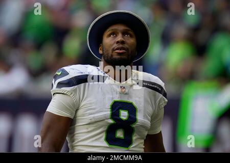 Seattle Seahawks defensive end Carlos Dunlap II (8) wears a decal for the  anniversary of 9-11 on his helmet on the sidelines during an NFL football  game against the Indianapolis Colts, Sunday