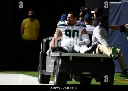 Seattle Seahawks nose tackle Bryan Mone (91) walks on the field