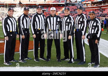 Referee Brad Rogers, left stands with replay official Durwood Manley before  an NFL football game between the Los Angeles Rams and the Las Vegas Raiders,  Thursday, Dec. 8, 2022, in Inglewood, Calif. (