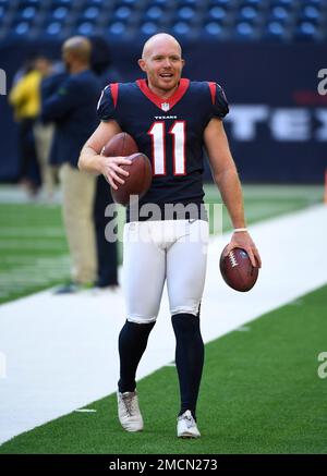 Houston Texans punter Cameron Johnston (11) tosses a bottle during warm-ups  before an NFL football game against the Jacksonville Jaguars on Sunday, Oct.  9, 2022, in Jacksonville, Fla. (AP Photo/Gary McCullough Stock