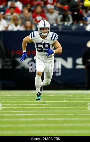 INDIANAPOLIS, IN - DECEMBER 18: Indianapolis Colts Linebacker Jordan  Glasgow (59) walks off the field at the conclusion of the NFL football game  between the New England Patriots and the Indianapolis Colts