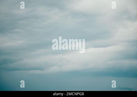 Overcast sky on rainy day with Nimbostratus clouds. Gloomy and moody background. Overcast clouds. Bad weather. Sad and depressed background. Stock Photo