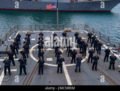 PEARL HARBOR (July 6, 2022) Sailors stand in formation during a weapons department all-hands call on the flight deck of the Arleigh Burke-class guided-missile destroyer USS Gridley (DDG 101) while moored at Joint Pearl Harbor-Hickam. Abraham Lincoln Carrier Strike Group is underway conducting routine operations in U.S. 3rd Fleet. Stock Photo