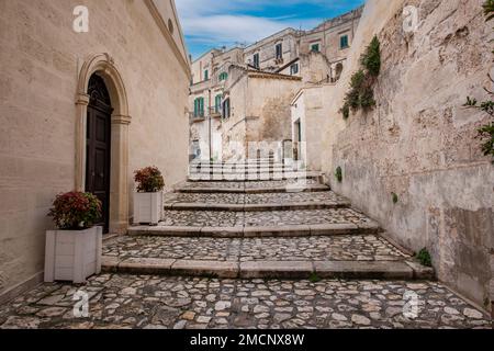 Building in the old town of Matera, Basilicata, Southern Italy with blue sky and white clouds(Sassi di Matera) Stock Photo